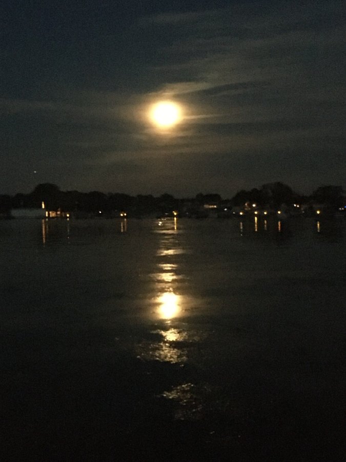 Full moon rising over the harbor at West Harbor Club, moonlight on the water